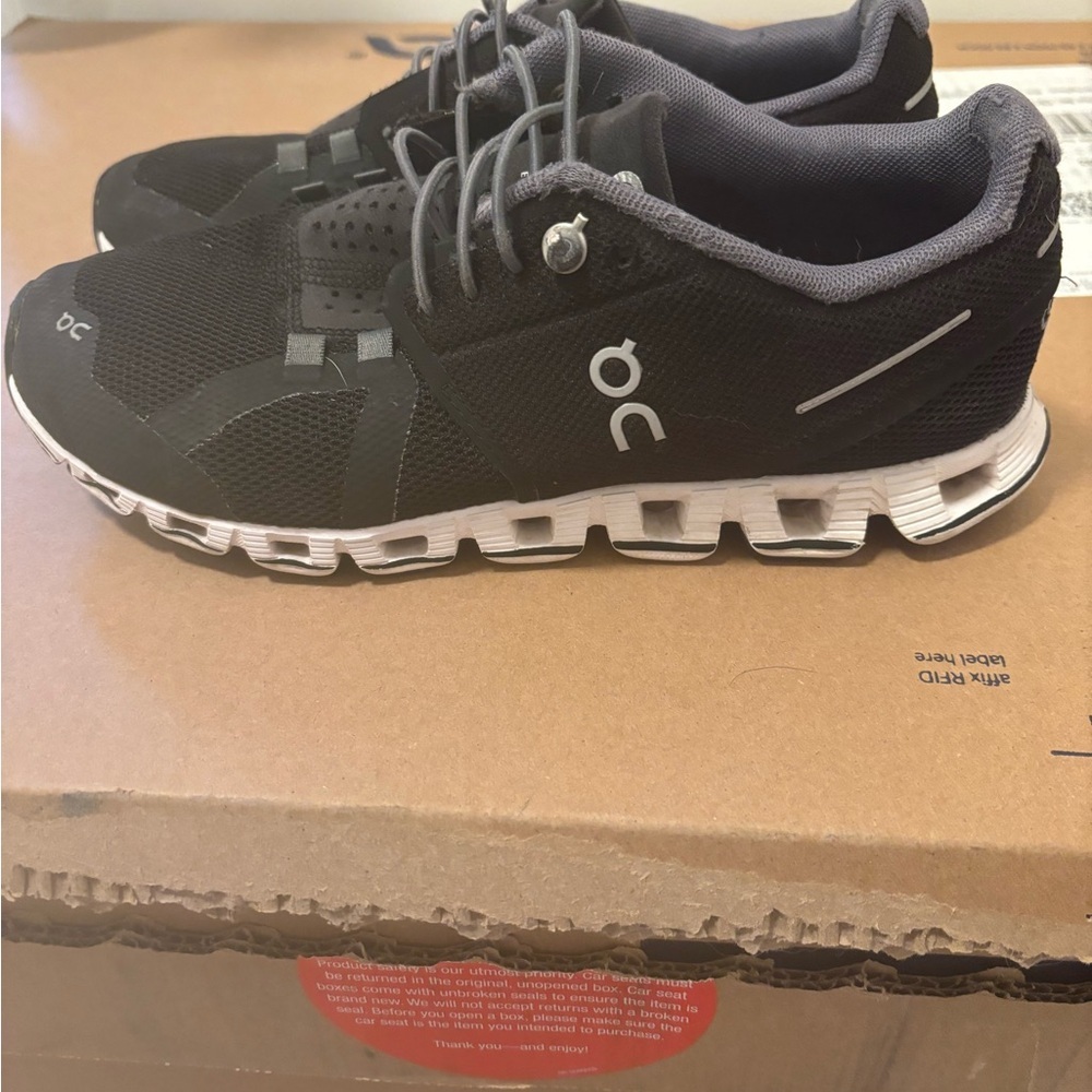 On Running Black and White Sneakers